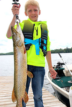 boy catches pike