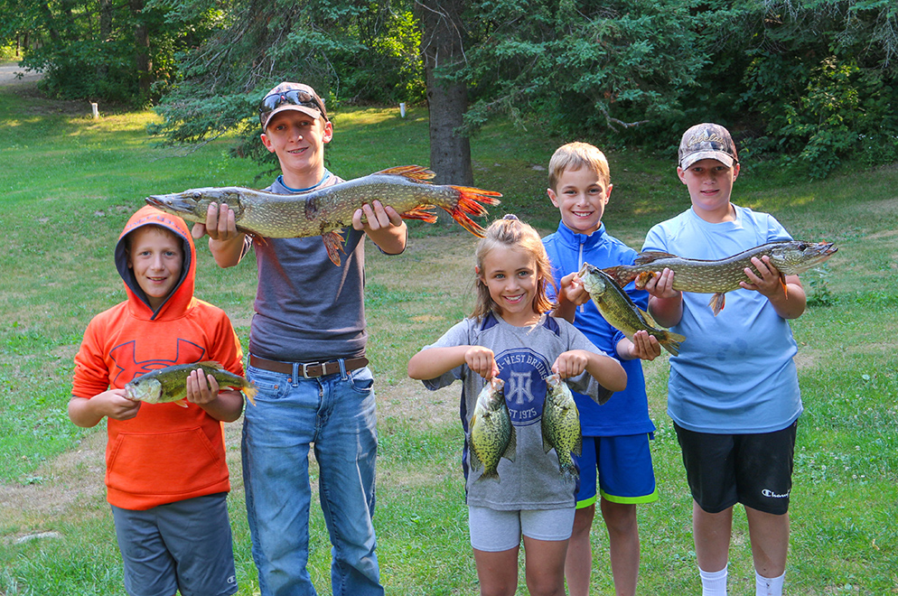 group of kids with fish