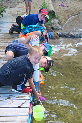 kids fishing on dock