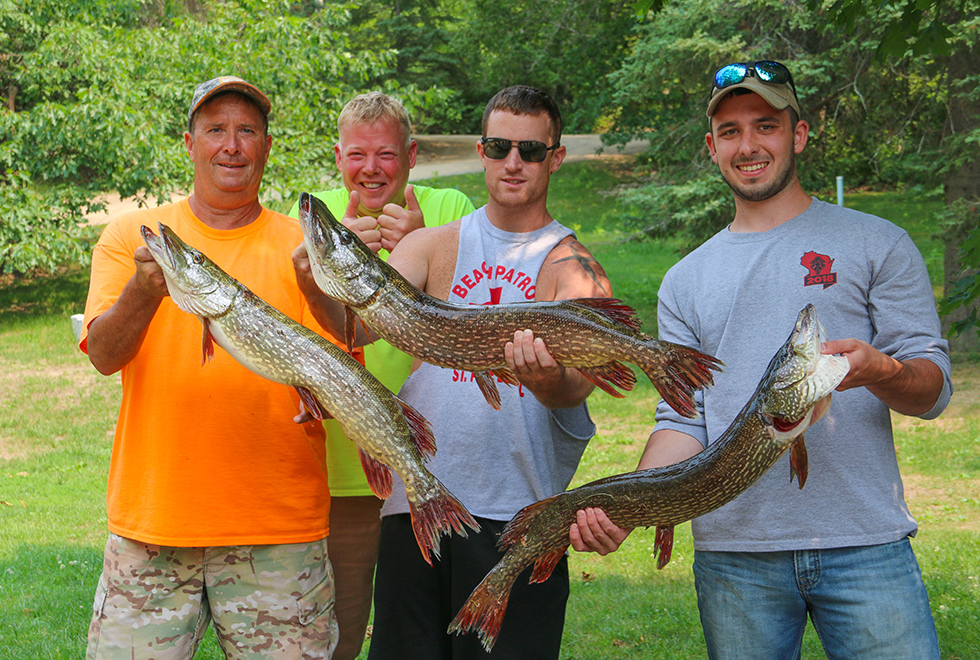 men caught 3 big fish