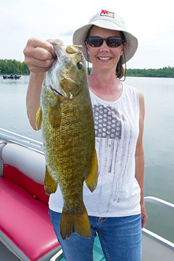 woman catches fish